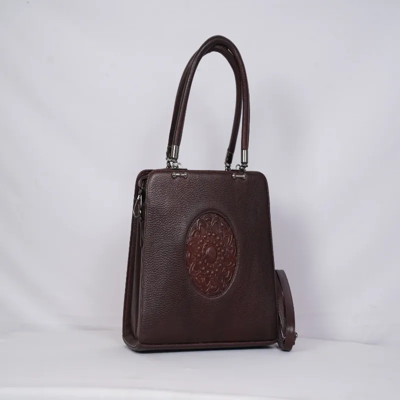 Handcrafted Leather Satchel Mandala-embossed circular patch.
